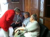 Sister Jeanie speaks with people in Waterloo